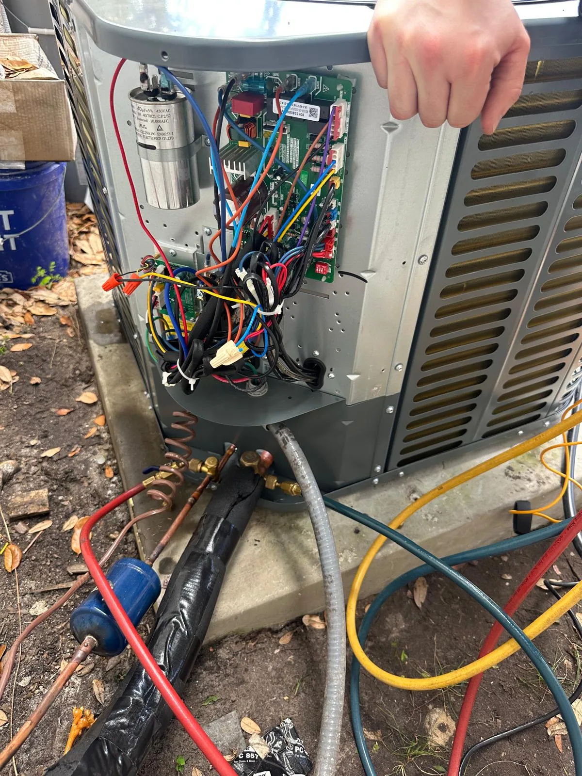 Residential AC condenser opened for HVAC diagnostic service