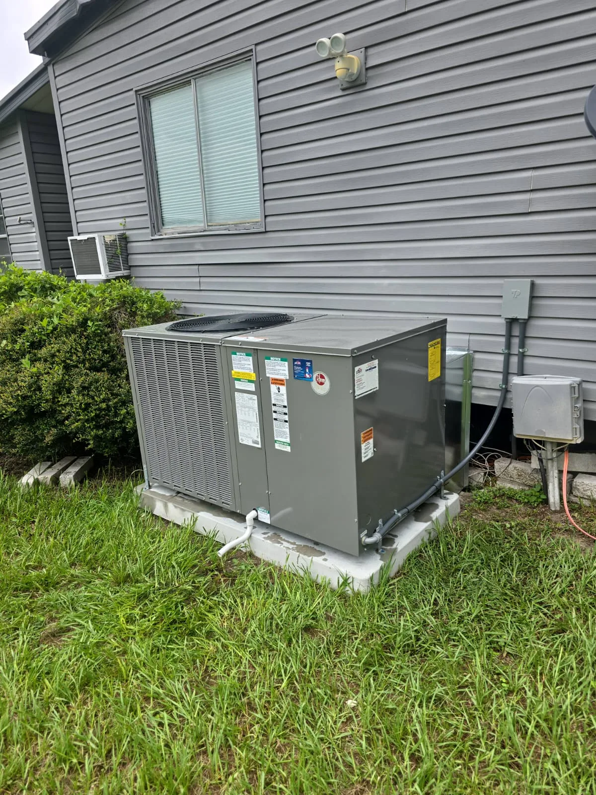 Residential outdoor air conditioner installed for an AC replacement project
